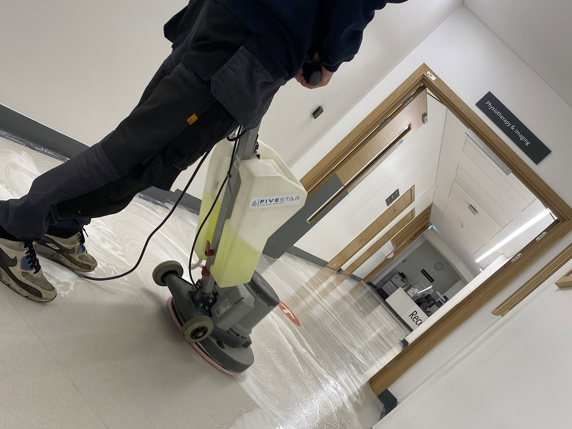 Floor cleaning hospital corridor