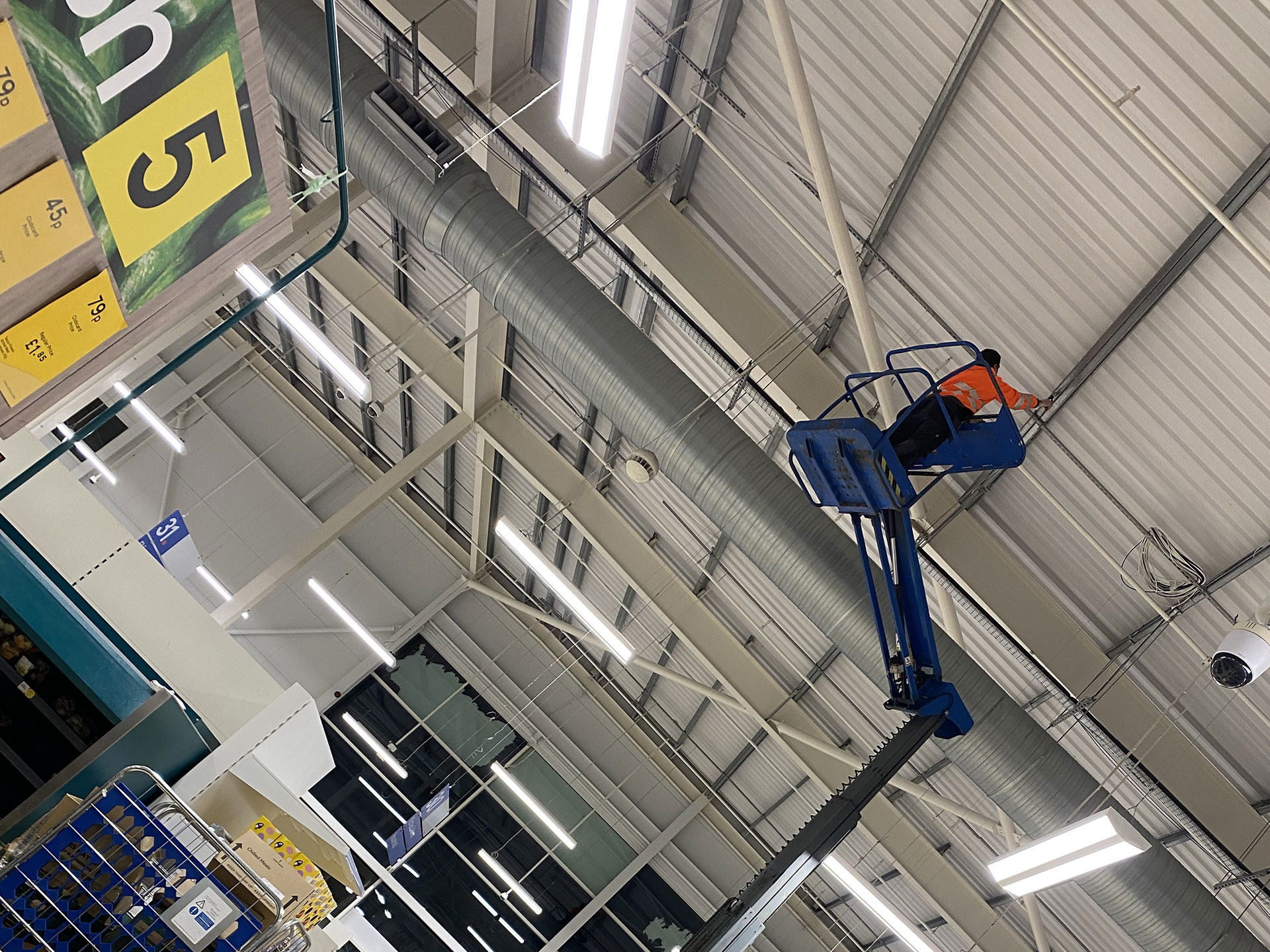 Cleaning ceiling of large warehouse