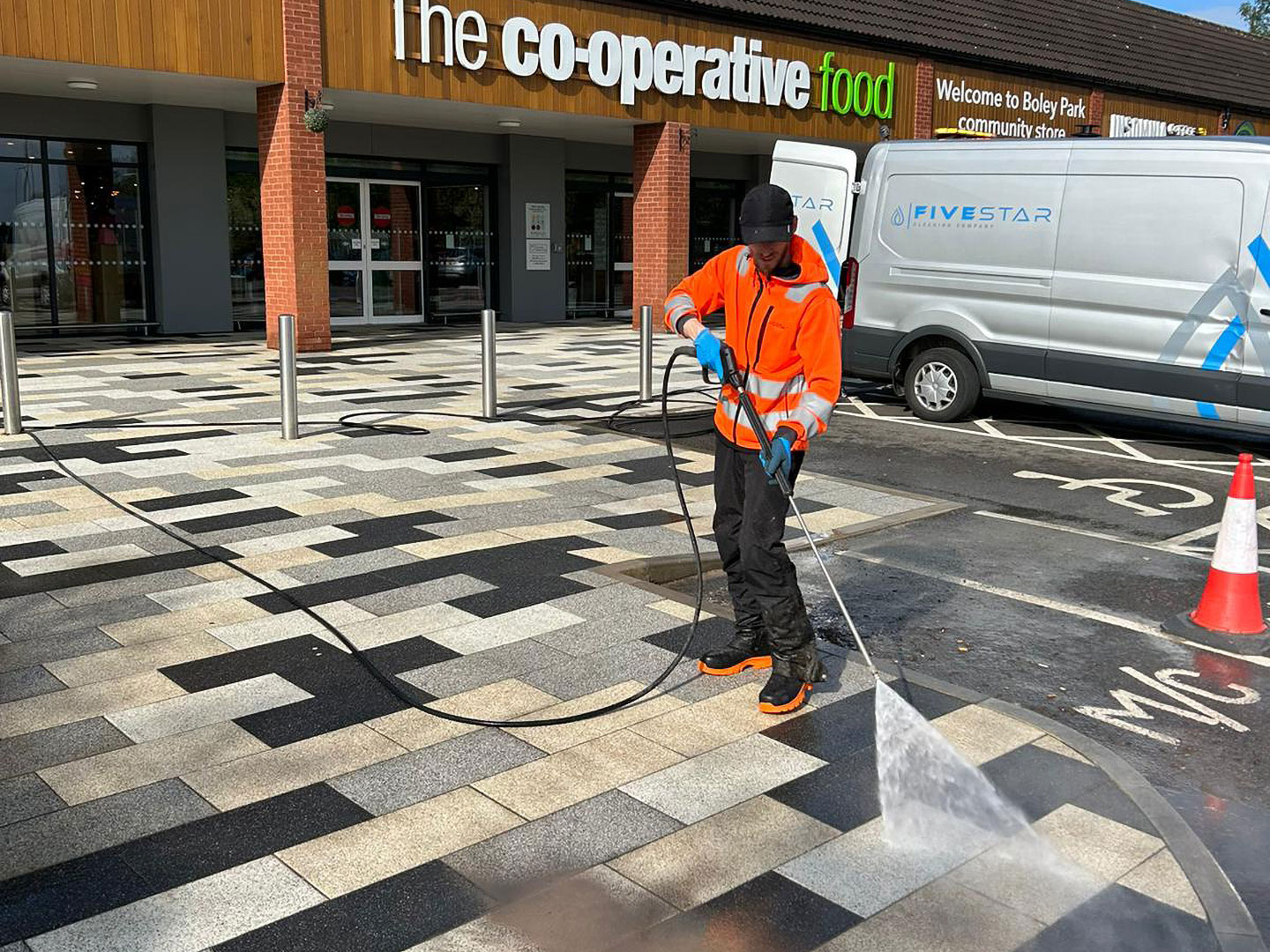 Pressure washing the Co-operative food paving